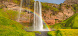 Amazing Seljalandsfoss waterfall with rainbow - Iceland