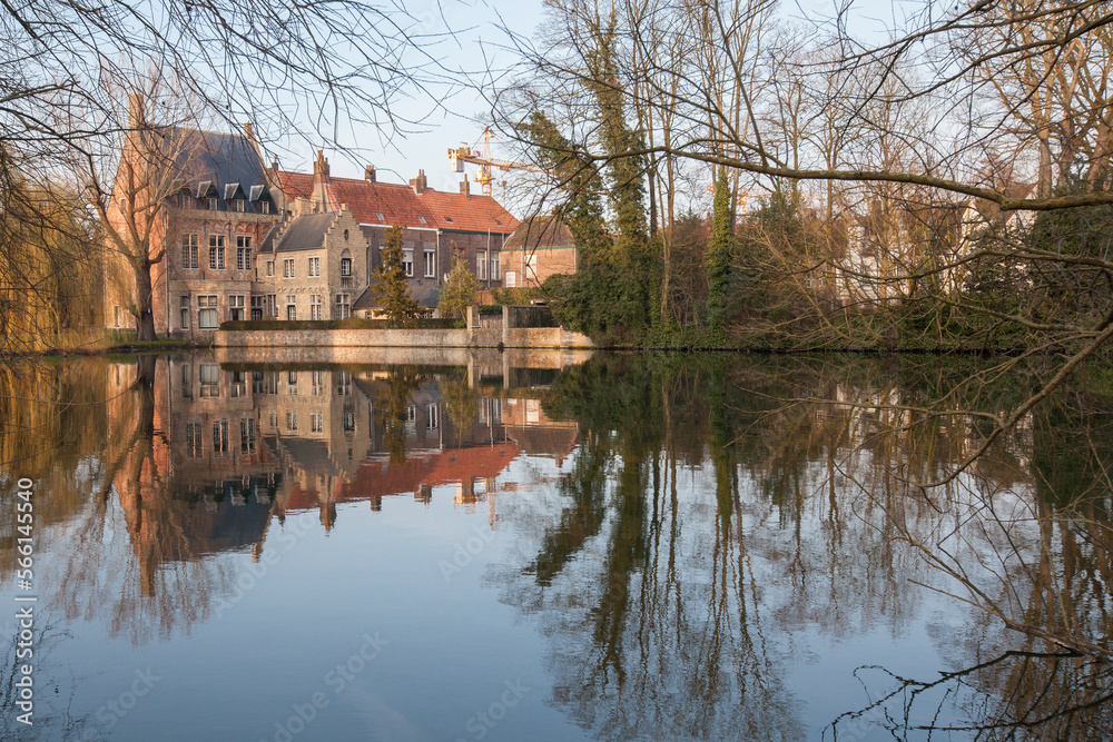 Medieval building (Castle) on Love lake, Minnewater Park in Bruges, Belgium