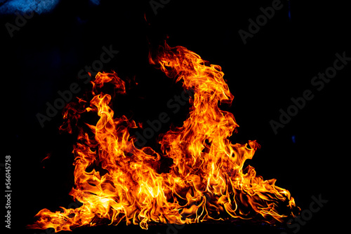 Texture of fire on a black background. Abstract fire flame background, large burning fire.