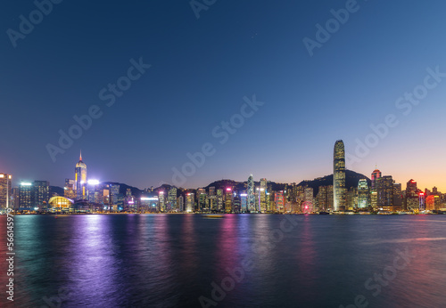 Skyline and harbor of Hong Kong city at dusk