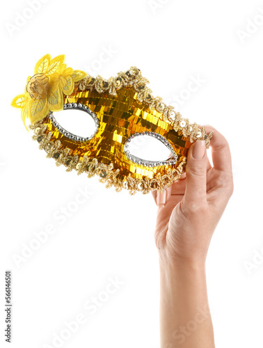 Woman with yellow carnival mask for Purim holiday on white background