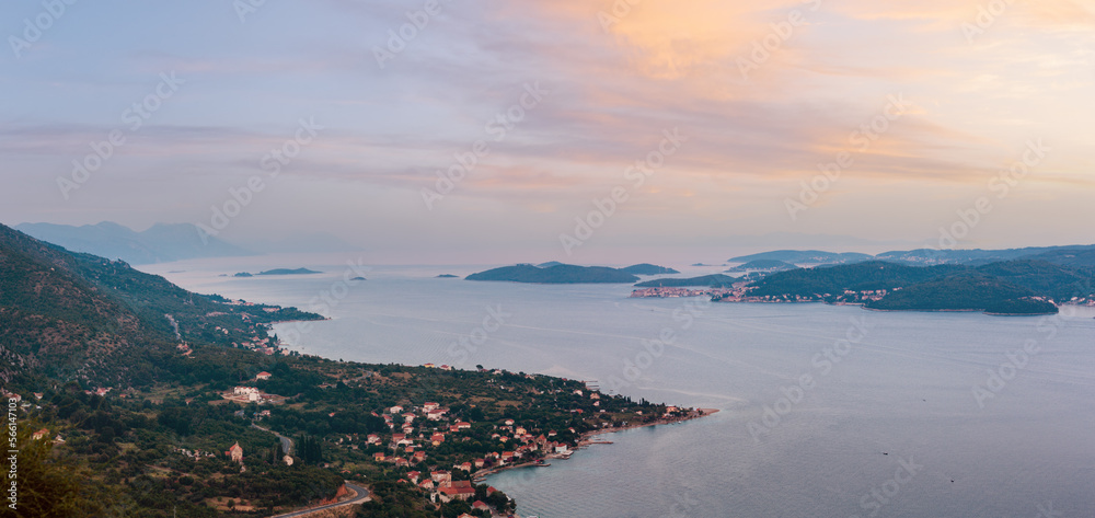 Sea twilight panorama, Croatian islands and Viganj village on seashore (Peljesac peninsula, Croatia).