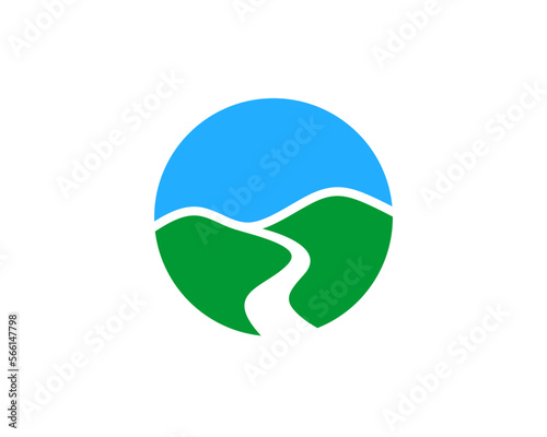 Green hill with roadway and blue sky view logo