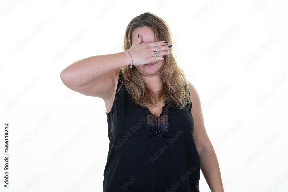 shy woman oversize young chubby hiding behind hand palm portrait on white background shy woman oversize young chubby hiding behind hand palm portrait on white background