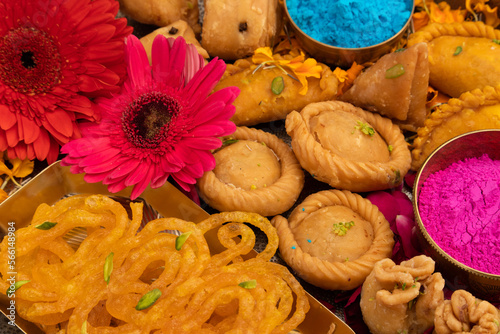 Indian Festival Of Colors Holi Is Celebrated With Colorful Gulal Abeer, Kesar Pista Badam Thandai, Gujiya, Mawa Potli Gujia, Chandrakala, Mithai, Water Gun, Dry Fruits, Bhang, Laung Latta, Samosa photo