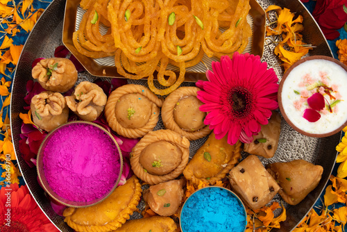 Indian Festival Of Colors Holi Is Celebrated With Colorful Gulal Abeer, Kesar Pista Badam Thandai, Gujiya, Mawa Potli Gujia, Chandrakala, Mithai, Water Gun, Dry Fruits, Bhang, Laung Latta, Samosa photo