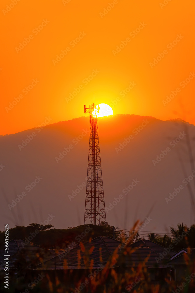 Telephone tower, radio tower during sunset. Telecommunication Tower for 2G 3G 4G 5G network, Cellular phone antenna, BTS, microwave, repeater, base station, IOT.