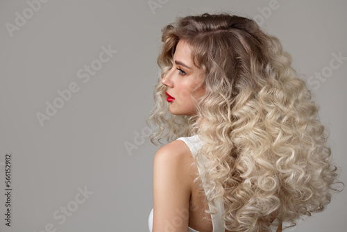 Canvas Print Curly fashion blonde woman with long hair and makeup