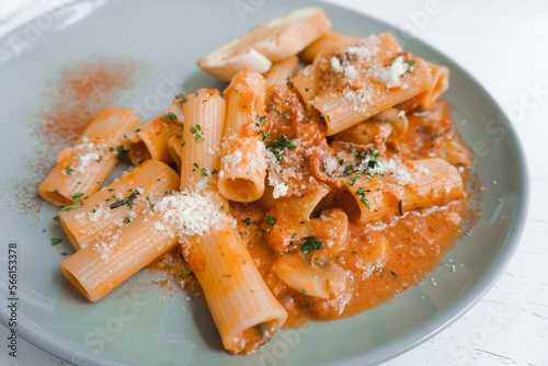 Pennette alla boscaiola - mushrooms tossed with pasta in a silky garlic-herb tomato cream sauce. photo