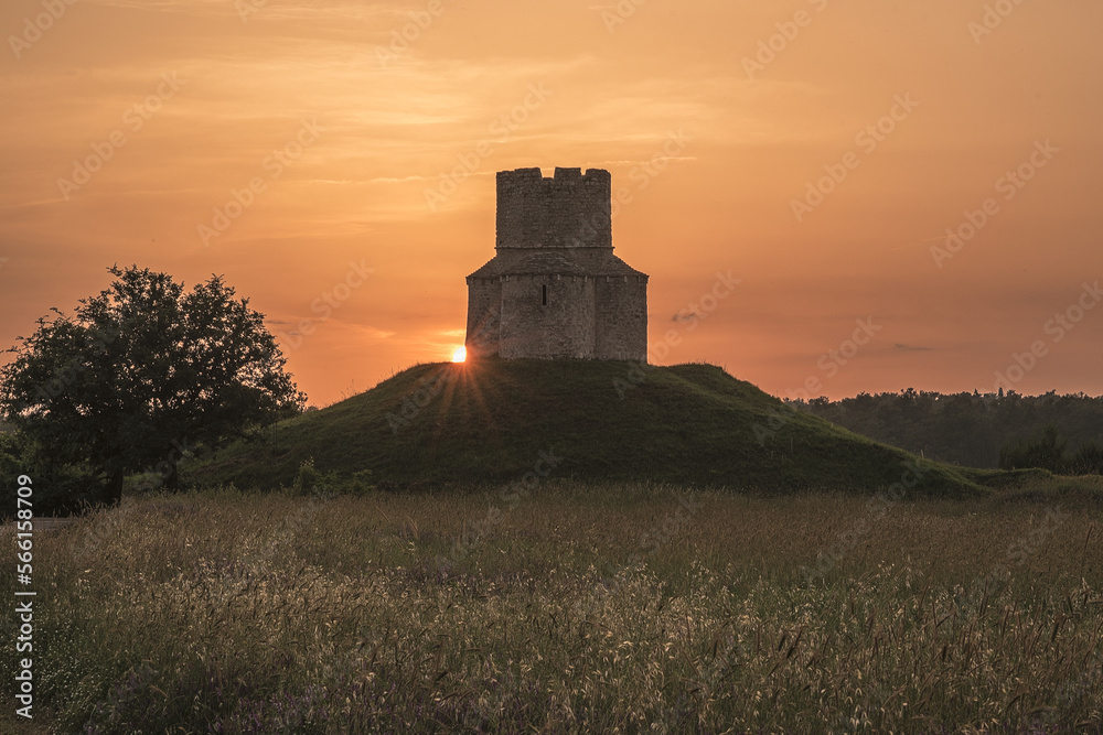 sunset over the castle against sun, background