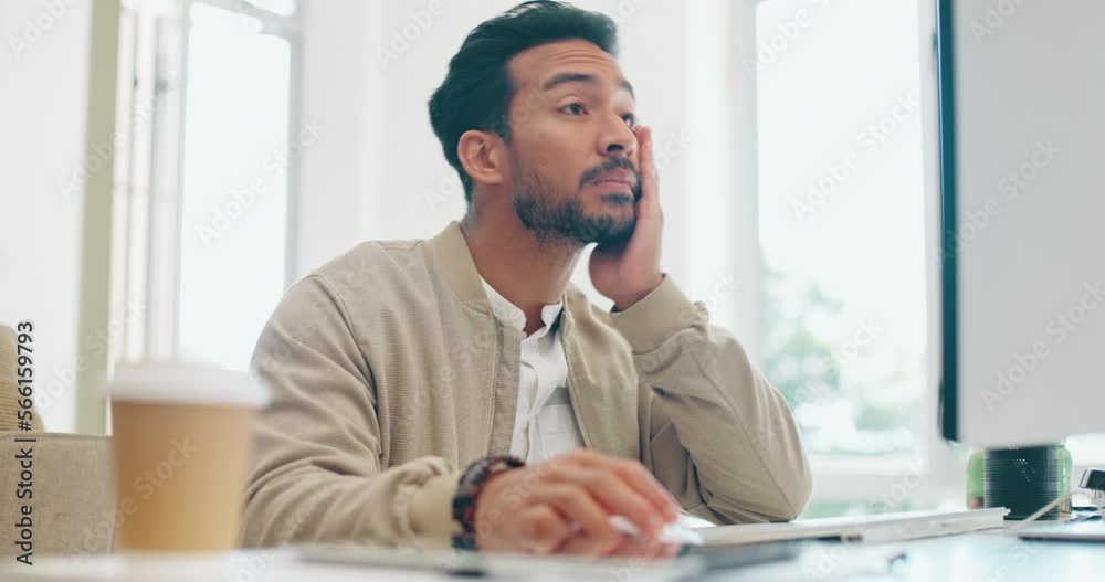 Stress, headache and man working in a office with a deadline for a creative project. Frustrated, tired and exhausted male employee doing research for a advertising report on a computer in workplace.