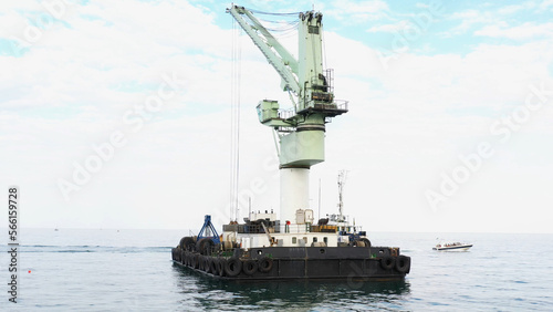 Floating marine crane in Odessa Black Sea. Offshore crane for loading goods in dry bulk cargo ships.