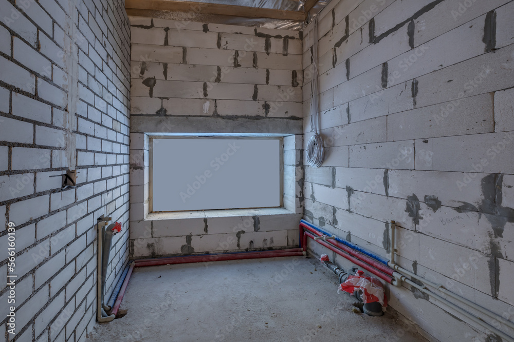 empty interior in house without repair with white silicate brick walls empty interior in house without repair with white silicate brick walls