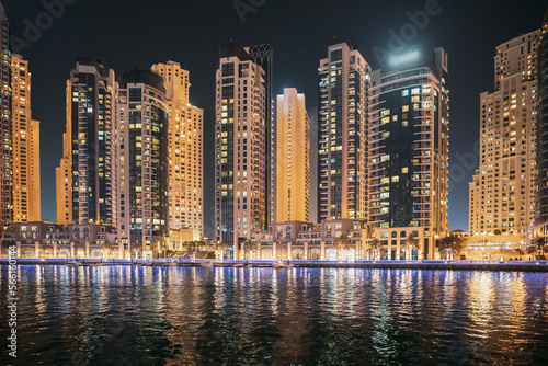 Night view of high-rise buildings of residential district in Dubai Marina. Dubai Marina Towers. Dubai Marina Skyline Background. Holidays In United Arab Emirates. Vacation In UAE. Night view of high