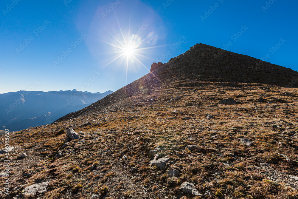 Opposite from Big Almaty peak from the side of Almaty in the rays of the bright sun