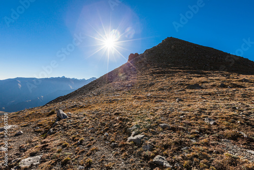 Obraz na płótnie Opposite from Big Almaty peak from the side of Almaty in the rays of the bright sun w salonie