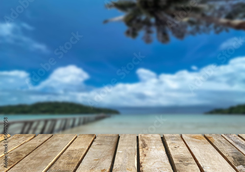 Fototapeta Naklejka Na Ścianę i Meble -  Wooden table top on the beach or sea.Party on the beach  sunshine time concept.For montage product display or design key visual layout.View of copy space.