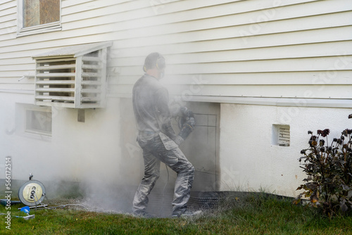 Adult man cutting beton hose wall. © oleksandr
