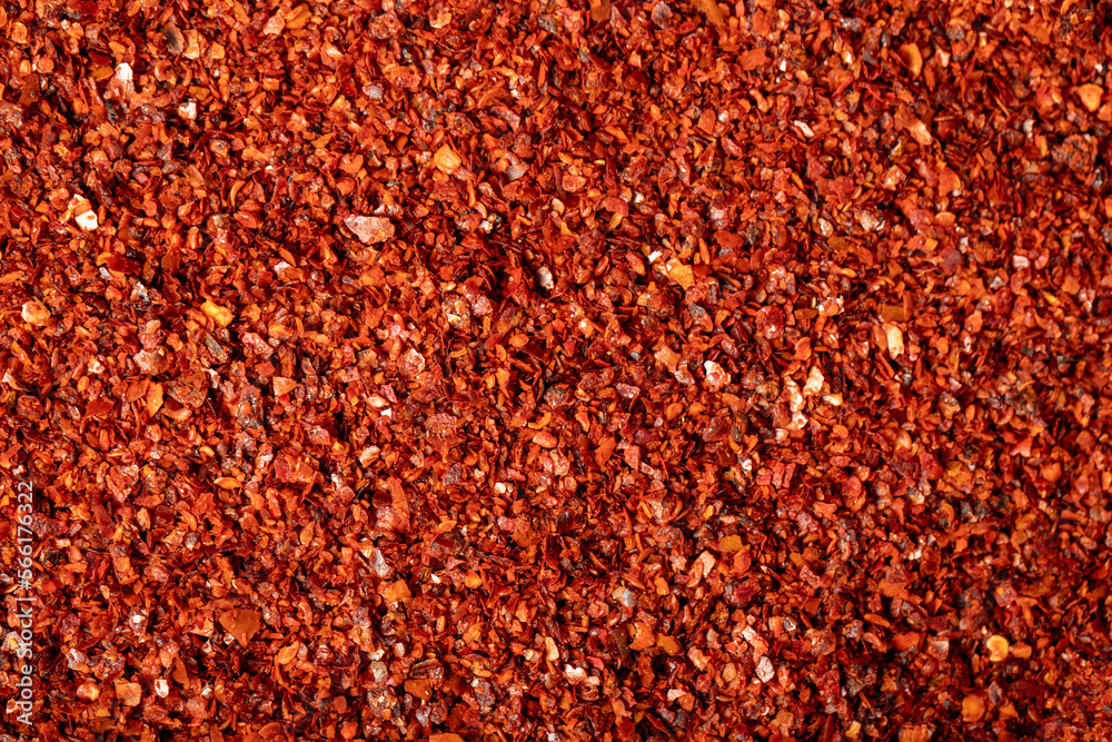 Red pepper flakes. Heap of crushed peppers. Top view of dried chili peppers. Close up - obrazy, fototapety, plakaty 