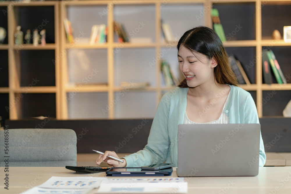 Financial analysis concept Asian woman working on documents on tablet laptop at workplace sitting at desk planning financial report business plan investment Financial analysis concept Asian woman working on documents on tablet laptop at workplace sitting at desk planning financial report business plan investment