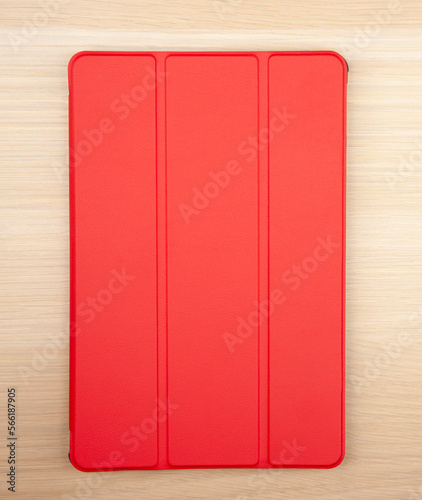 image of tablet case wooden desk background 