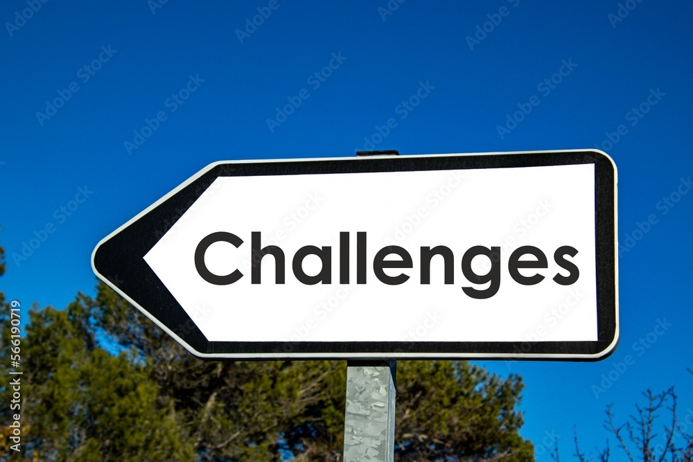 the word 'challenges' written on a road sign
