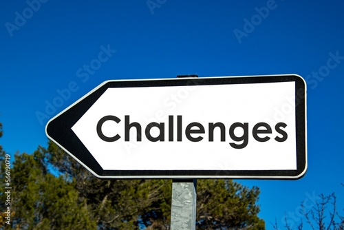 the word 'challenges' written on a road sign