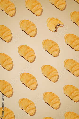 pattern of fresh bake gplden brown croissant for breakfast in bakery. minimal creative background composition. photo