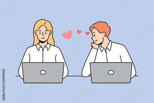 Young man in love look at female colleague working together at laptops in office. Male employee admire woman worker at workplace. Work romance. Vector illustration. 