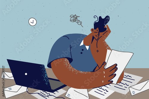 Tired employee overwhelmed with paperwork 