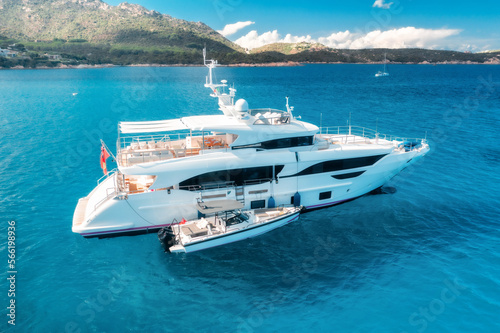 Aerial view of luxury yacht on blue sea in a summer. Beautiful seascape. Vacation, travel. Sardinia, Italy