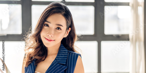 Beautiful happy confident asian businesswoman smart looking at camara while sitting on office workplace desk.Young creative coworkers business people working and planning Free Download Beautiful happy confident asian businesswoman smart looking at camara while sitting on office workplace desk.Young creative coworkers business people working and planning - GFXLoad