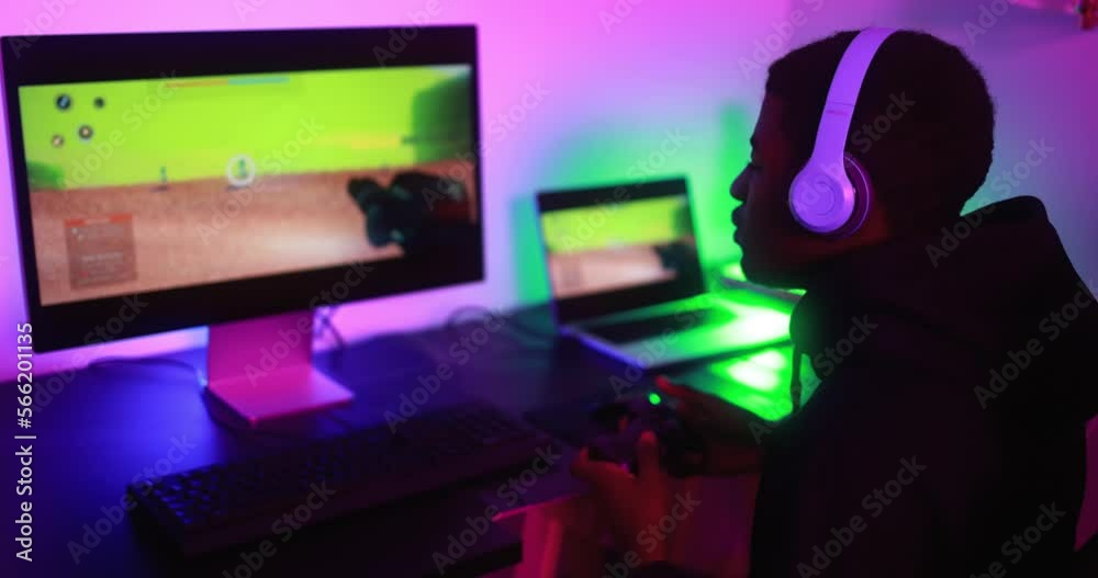 Young gamer playing at e-sports competition - New technology game trends and entertainment concept Young gamer playing at e-sports competition - New technology game trends and entertainment concept