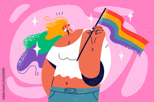 Smiling woman with LGBTQ flag in hands 