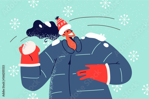 Smiling woman play snowballs 