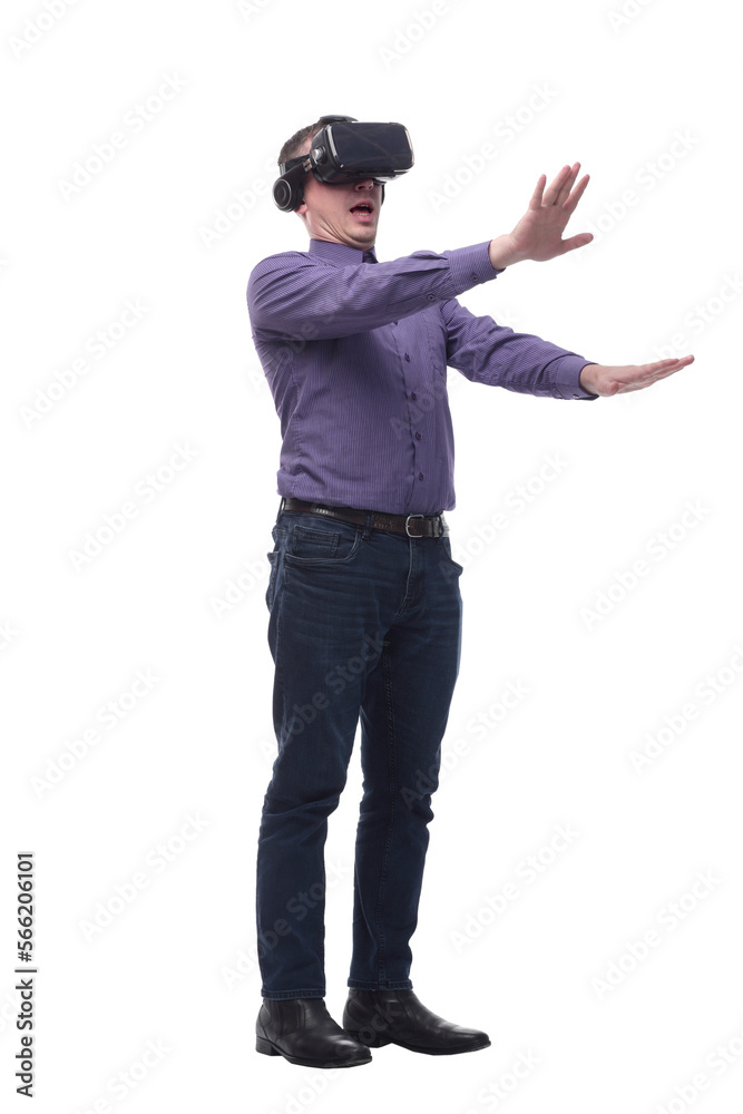 Excited man experiencing virtual reality via VR headset and touching something with his hands Excited man experiencing virtual reality via VR headset and touching something with his hands