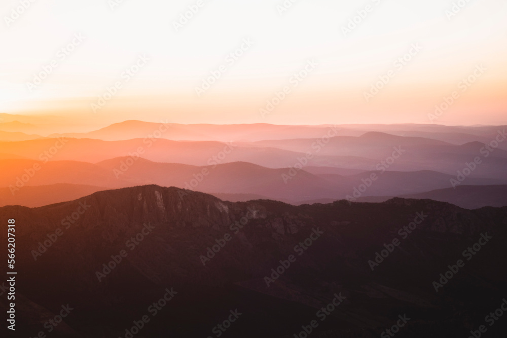 Horizontal view of beautiful layers of mountains with golden light at sunset in Las Villuercas, Cáceres, Extremadura, Spain