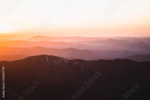 Horizontal view of beautiful layers of mountains with golden light at sunset in Las Villuercas, Cáceres, Extremadura, Spain