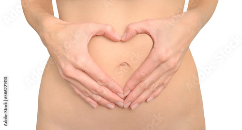 Wallpaper Mural A young slender woman without clothes. Standing, folded her hands in the shape of a heart on her bare stomach. Close-up of the middle part of a fit young woman. Isolated. Torontodigital.ca