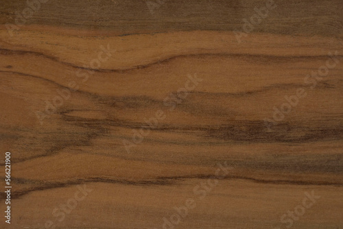 Texture of a cut old teak wood for background. Raw unfinished surface uneven are flaky from cutting and has a beautiful wood grain.