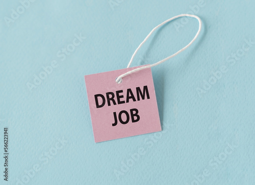 Dream Job text quote on a pink card, Business Concept on Blue Background