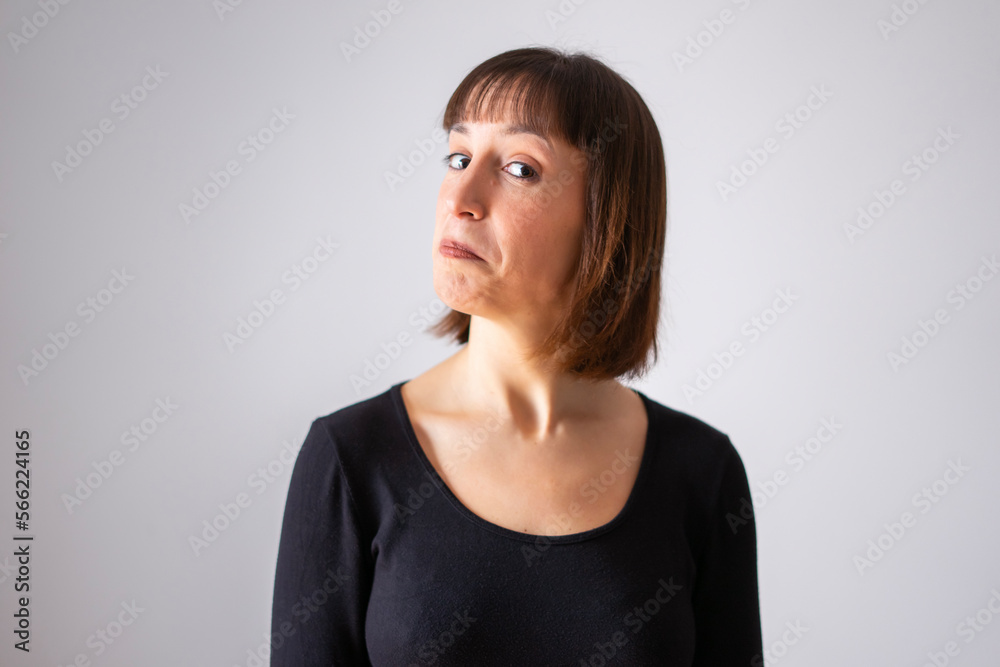 Portrait of a girl on white background. Brown short hair girl. Girl with a face of not knowing anything Portrait of a girl on white background. Brown short hair girl. Girl with a face of not knowing anything