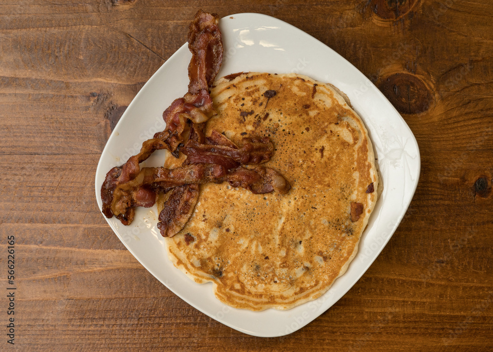Pancakes and bacon on a plate