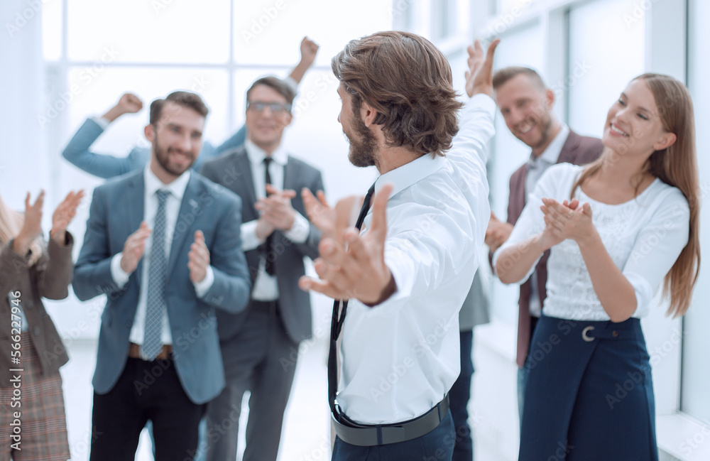 happy young business man pointing at you. happy young business man pointing at you.