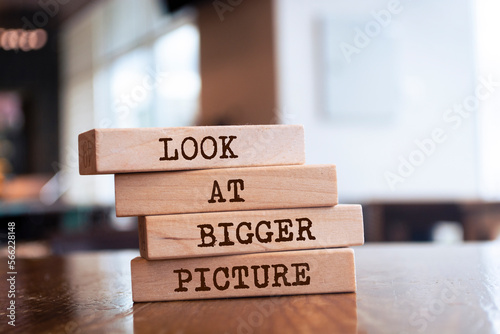 Wooden blocks with words 'Look at bigger picture'.