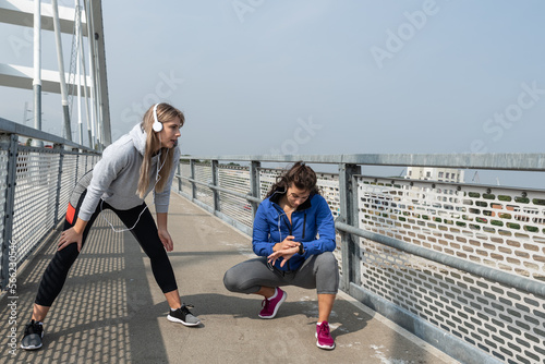 Young woman helps and supports her friend who survived cancer to completely defeat the vicious disease and start a new healthier life with good habits and a healthy body © Srdjan