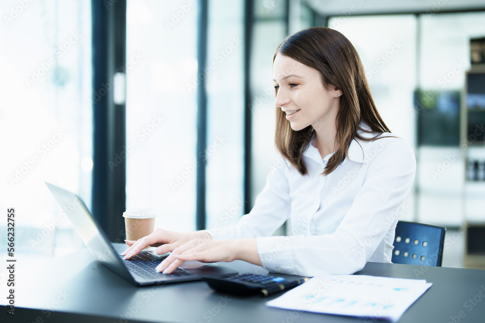 Business planning, portrait of a business woman using a computer to audit financial statements and marketing Business planning, portrait of a business woman using a computer to audit financial statements and marketing