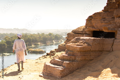 Man Overlooking the Nile River from Ancient Ruins in Aswan, Egypt