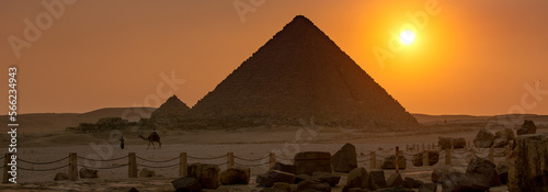 Panoramic photograph of the sunset over the pyramid of Menkaure with camel