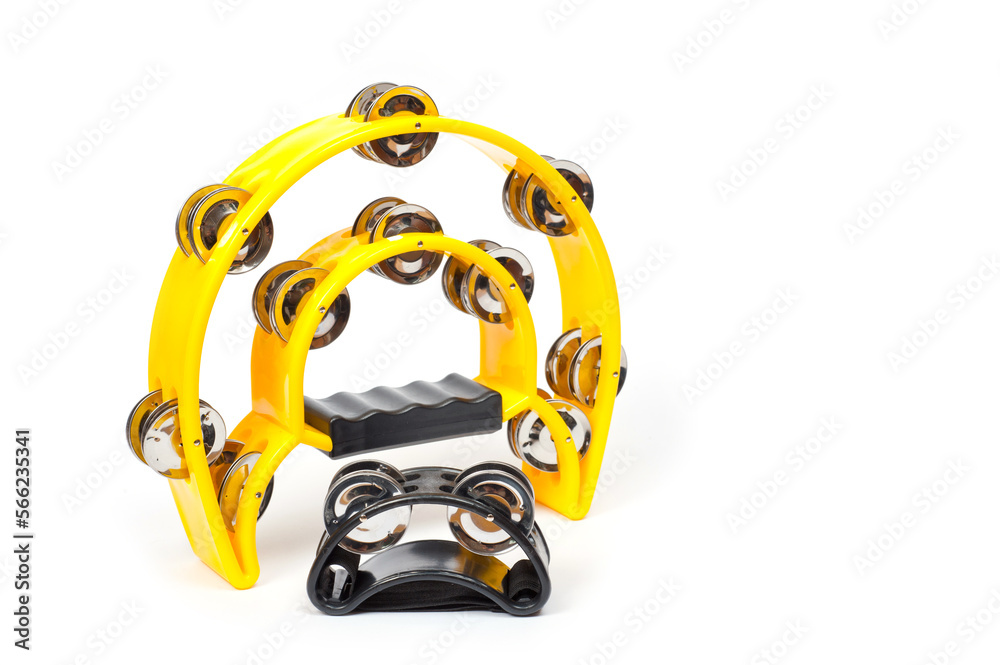 The tambourine is large semicircular yellow and a small black tambourine for attaching to the arm or leg of the musician.